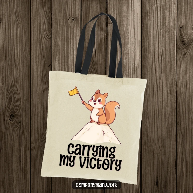 Funny tote bag featuring an enthusiastic squirrel waving a flag at a summit, perfect for carrying essentials with pride.